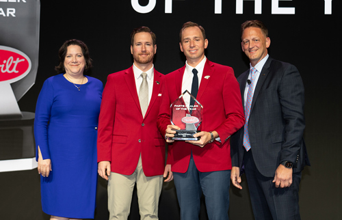 The Larson Group receiving the 2023 eCommerce Dealer of the Year Award